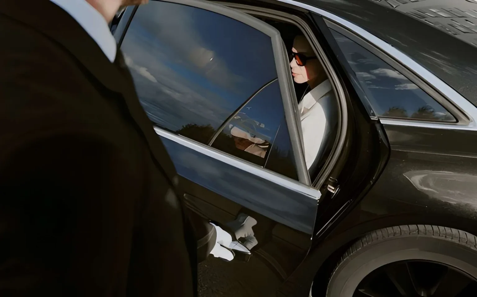 Chauffeur opening the door for a passenger